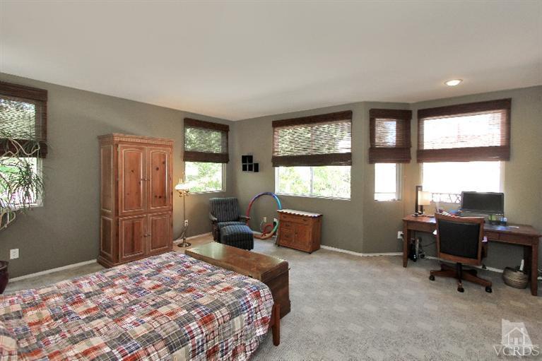 3853 Timberridge Road Moorpark, CA 93021 - Photo 29 of 42 a bedroom with a bed and large windows
