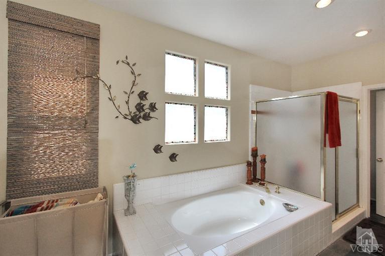 3853 Timberridge Road Moorpark, CA 93021 - Photo 30 of 42 a bathroom with a bathtub and a shower