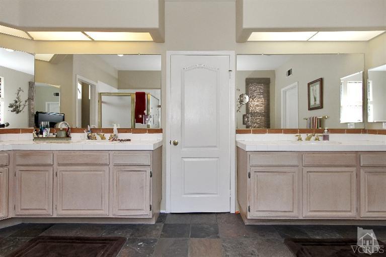 3853 Timberridge Road Moorpark, CA 93021 - Photo 32 of 42 a bathroom with a sink vanity and mirror