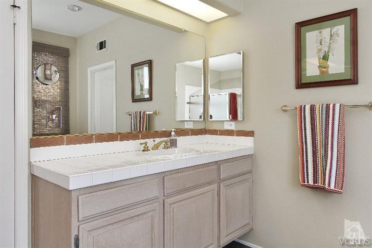 3853 Timberridge Road Moorpark, CA 93021 - Photo 33 of 42 a bathroom with a sink a vanity and a mirror