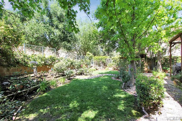 3853 Timberridge Road Moorpark, CA 93021 - Photo 37 of 42 a view of a yard with plants and a large tree