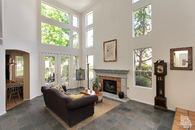 3853 Timberridge Road Moorpark, CA 93021 - Photo 6 of 42 a living room with furniture a large window and a fireplace