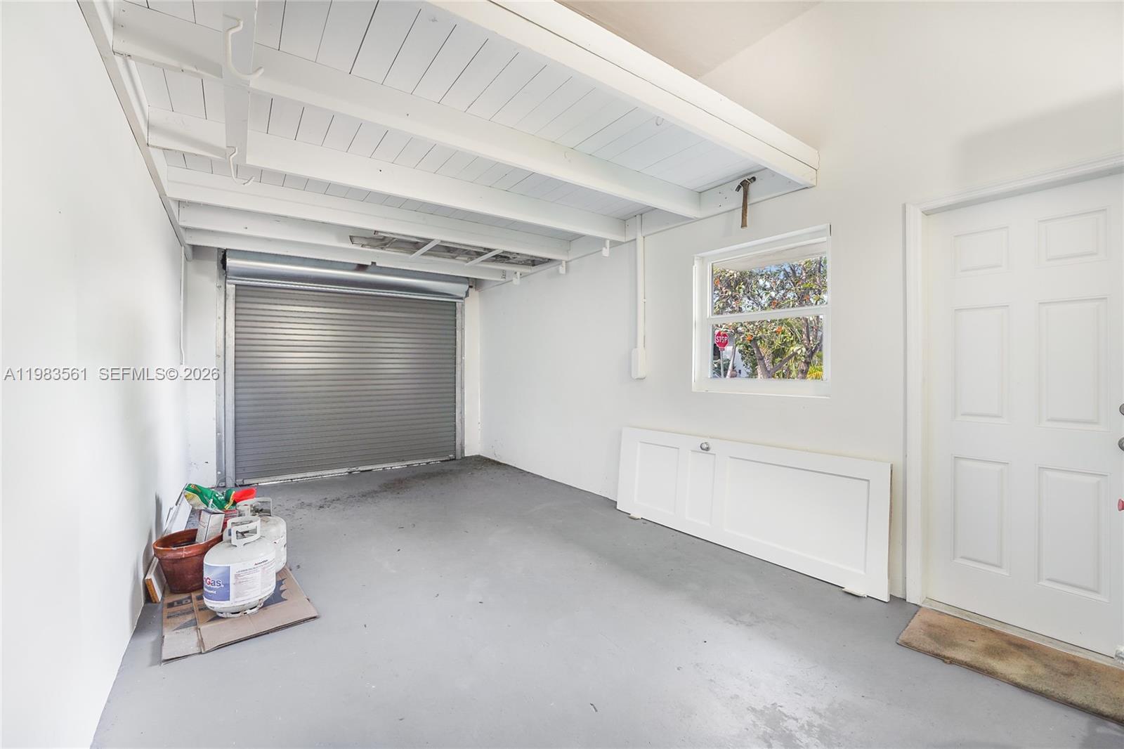 8975 Froude Avenue Surfside, FL 33154 - Photo 16 of 18 an empty room with toys and painted walls