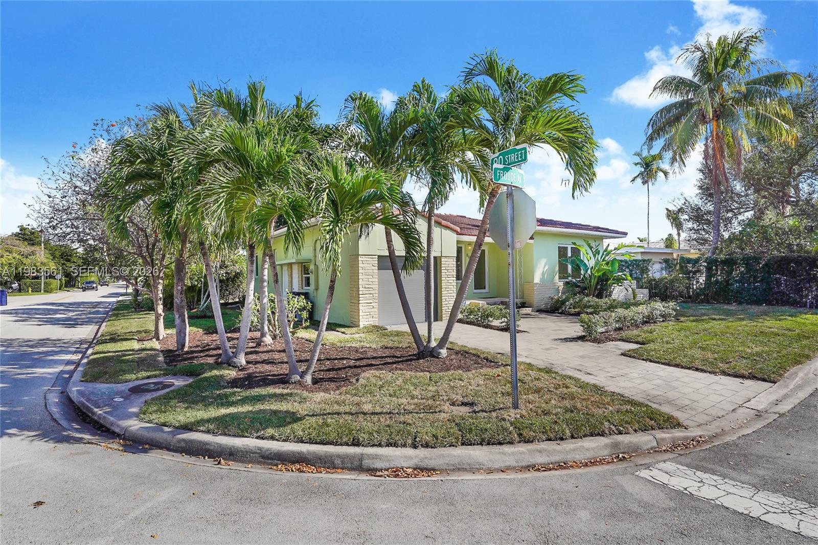 8975 Froude Avenue Surfside, FL 33154 - Photo 17 of 18 a view of a backyard with palm trees
