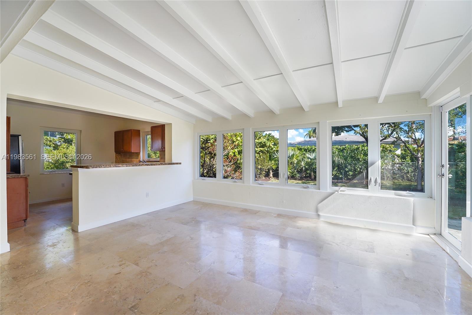 8975 Froude Avenue Surfside, FL 33154 - Photo 4 of 18 a view of an empty room with a window