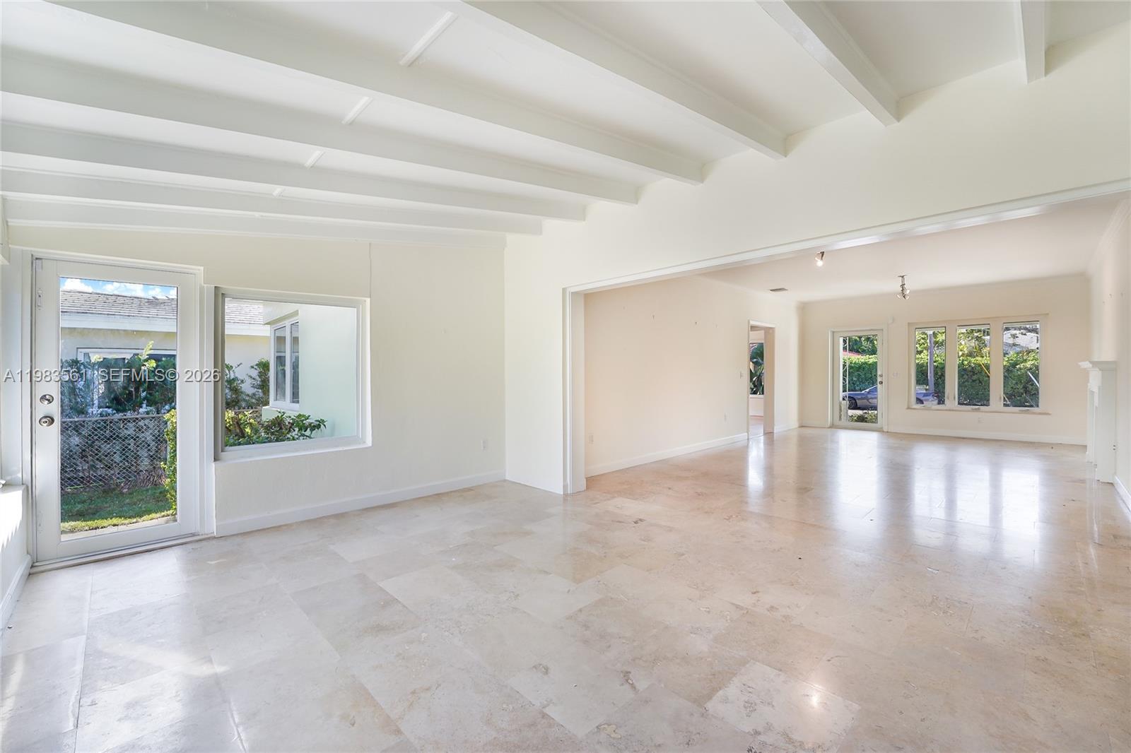 8975 Froude Avenue Surfside, FL 33154 - Photo 6 of 18 a view of an empty room with window