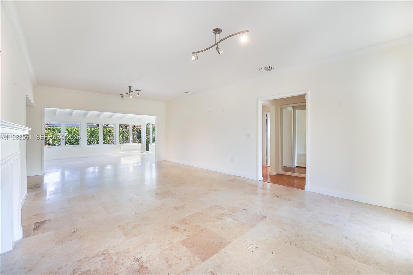 8975 Froude Avenue Surfside, FL 33154 - Photo 10 of 18 a view of an empty room with a window