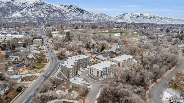 4016 South Burch Way Ogden, UT 84405 - Photo 27 of 30 Modern multi-story buildings featuring flat roofs, multiple balconies, and a neutral color palette