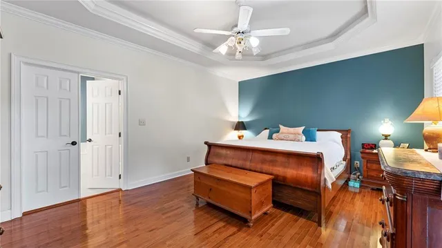 a bed room with a bed and a chandelier