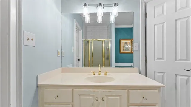 a bathroom with a sink and a mirror