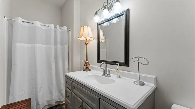 a bathroom with a sink and a mirror