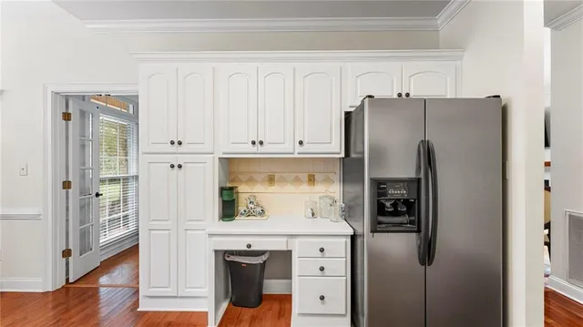 a kitchen with stainless steel appliances a refrigerator and a stove