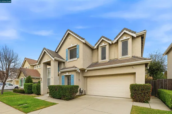 a front view of a house with garage
