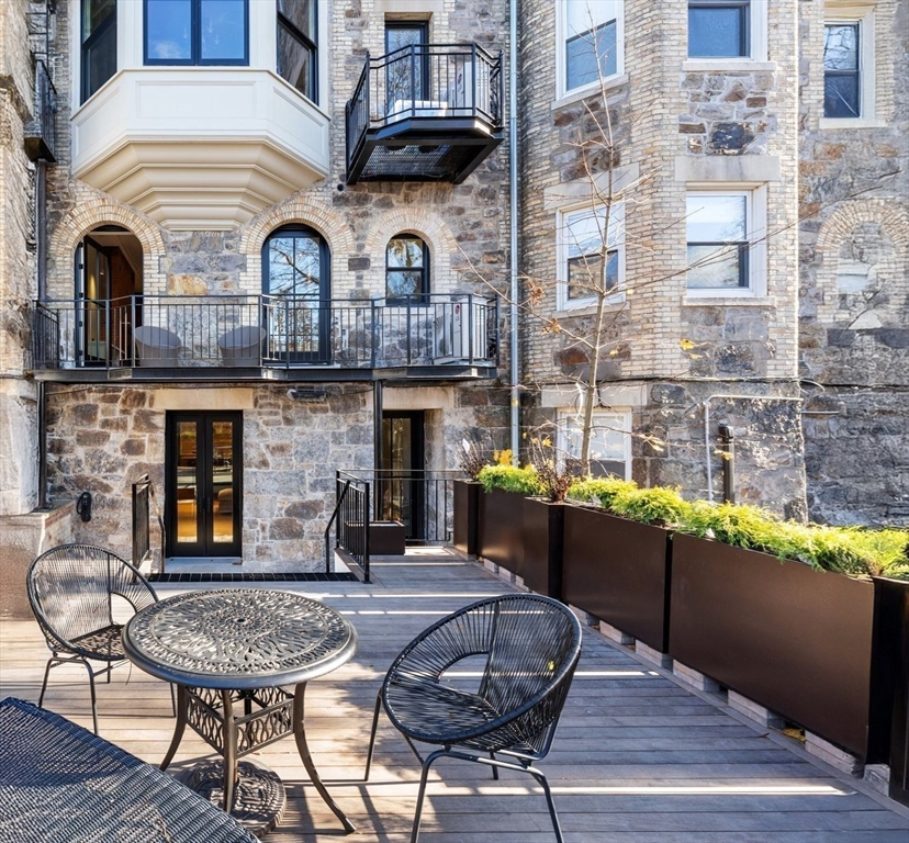 320 Tappan Street, Unit 4 Brookline, MA 02445 - Photo 15 of 18 a view of a dinning table and chairs in the balcony