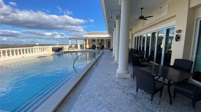 a view of swimming pool from a balcony