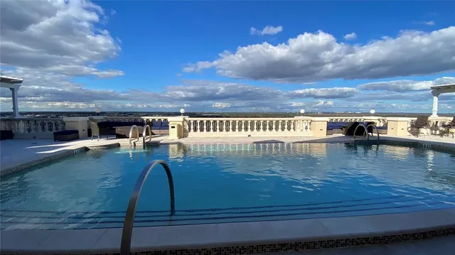 a view of a swimming pool with a garden