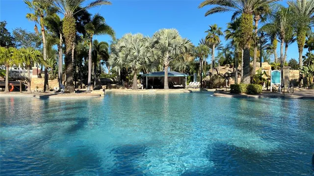 a view of a swimming pool with a table and chairs