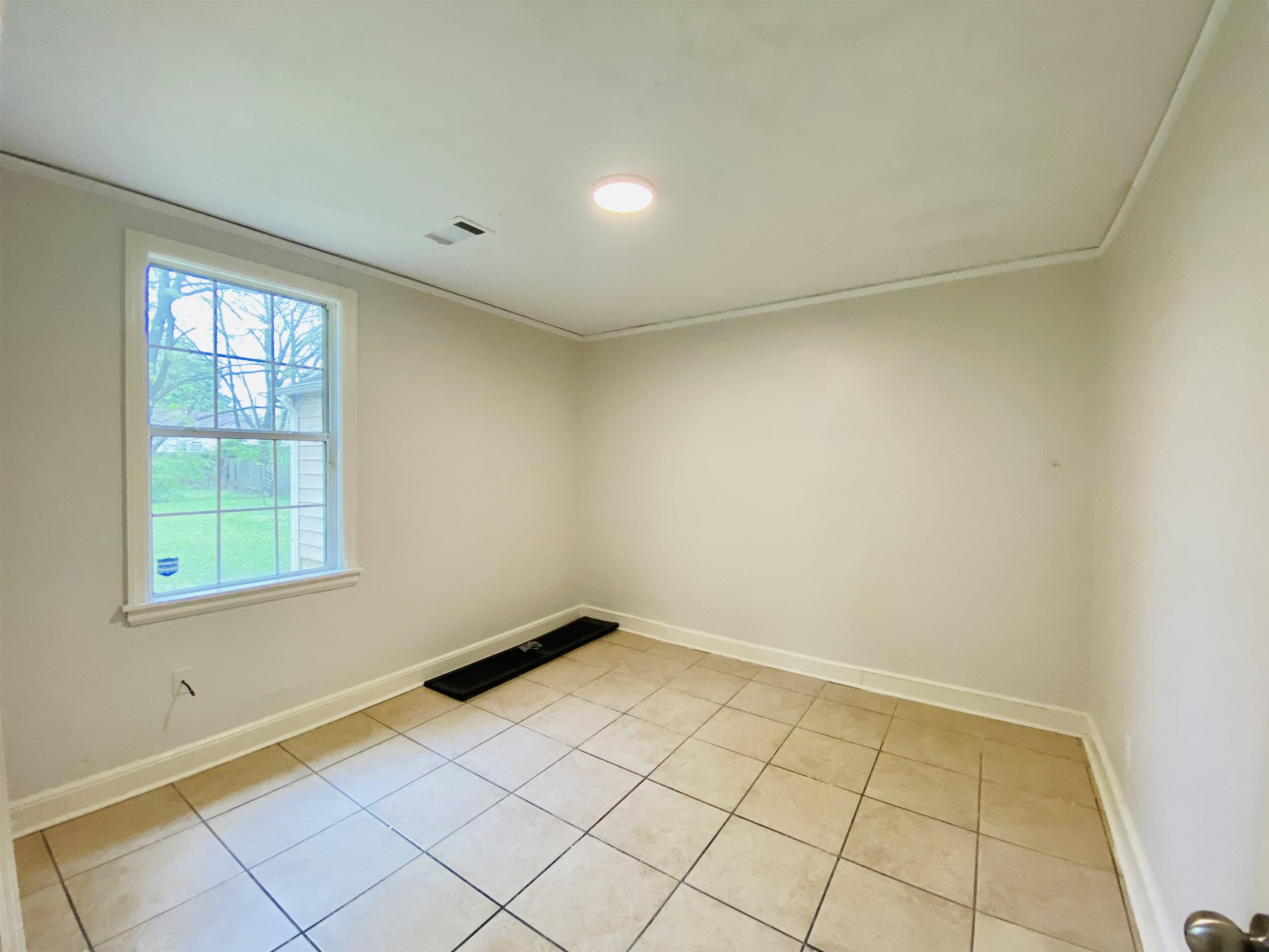 1253 Prescott Road Memphis, TN 38111 - Photo 7 of 13 an empty room with windows