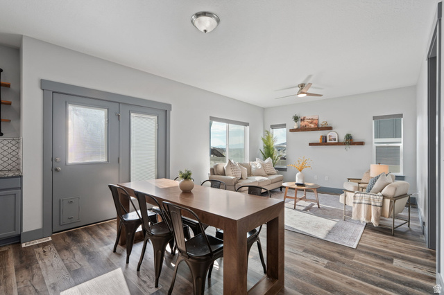 7822 North Copperbend Road Eagle Mountain, UT 84005 - Photo 14 of 46 Open-concept living space featuring wood-finish flooring, recessed lighting, and a ceiling fan