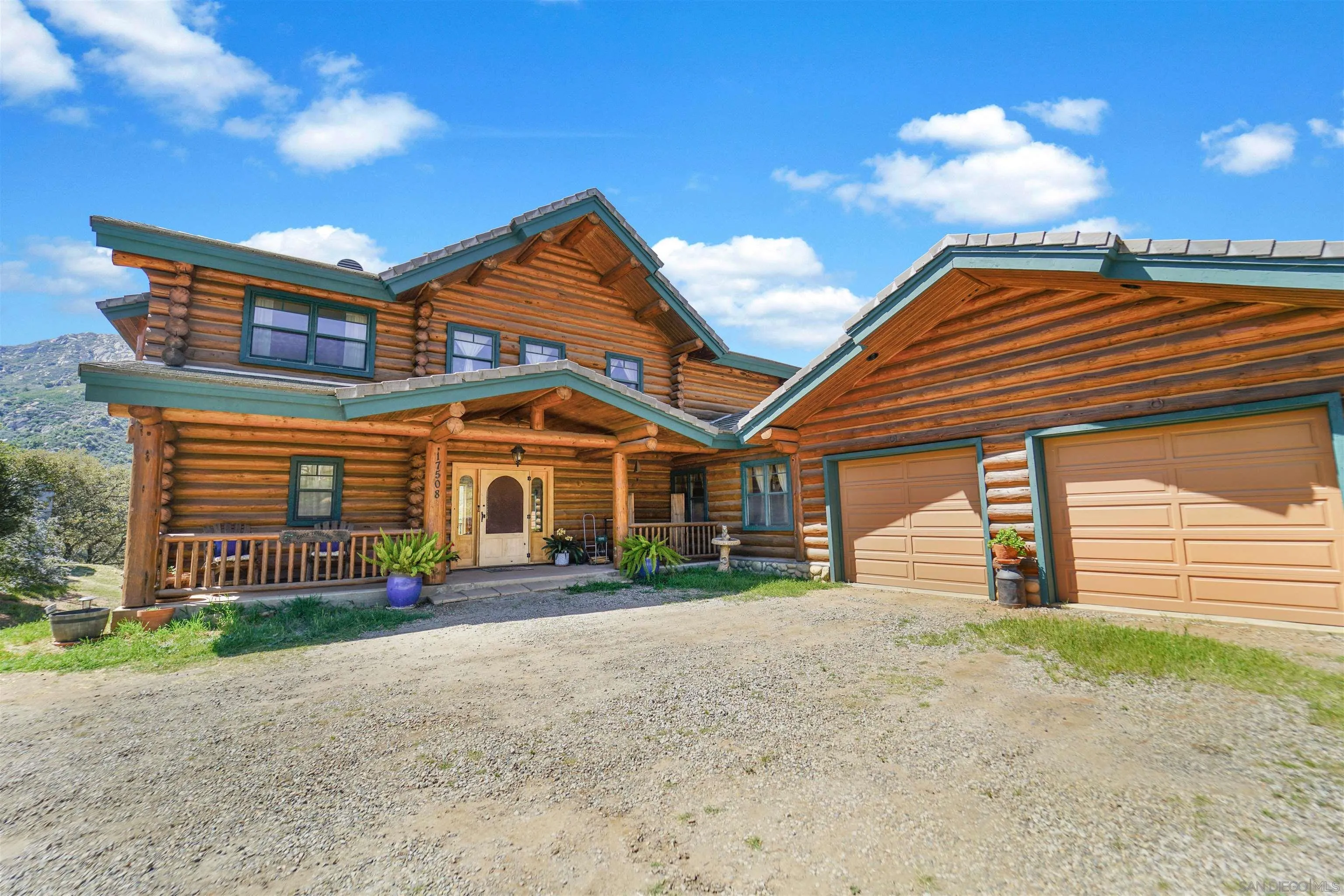 17508 Lyons Creek Road Jamul, CA 91935 - Photo 1 of 12 a front view of a house with a yard