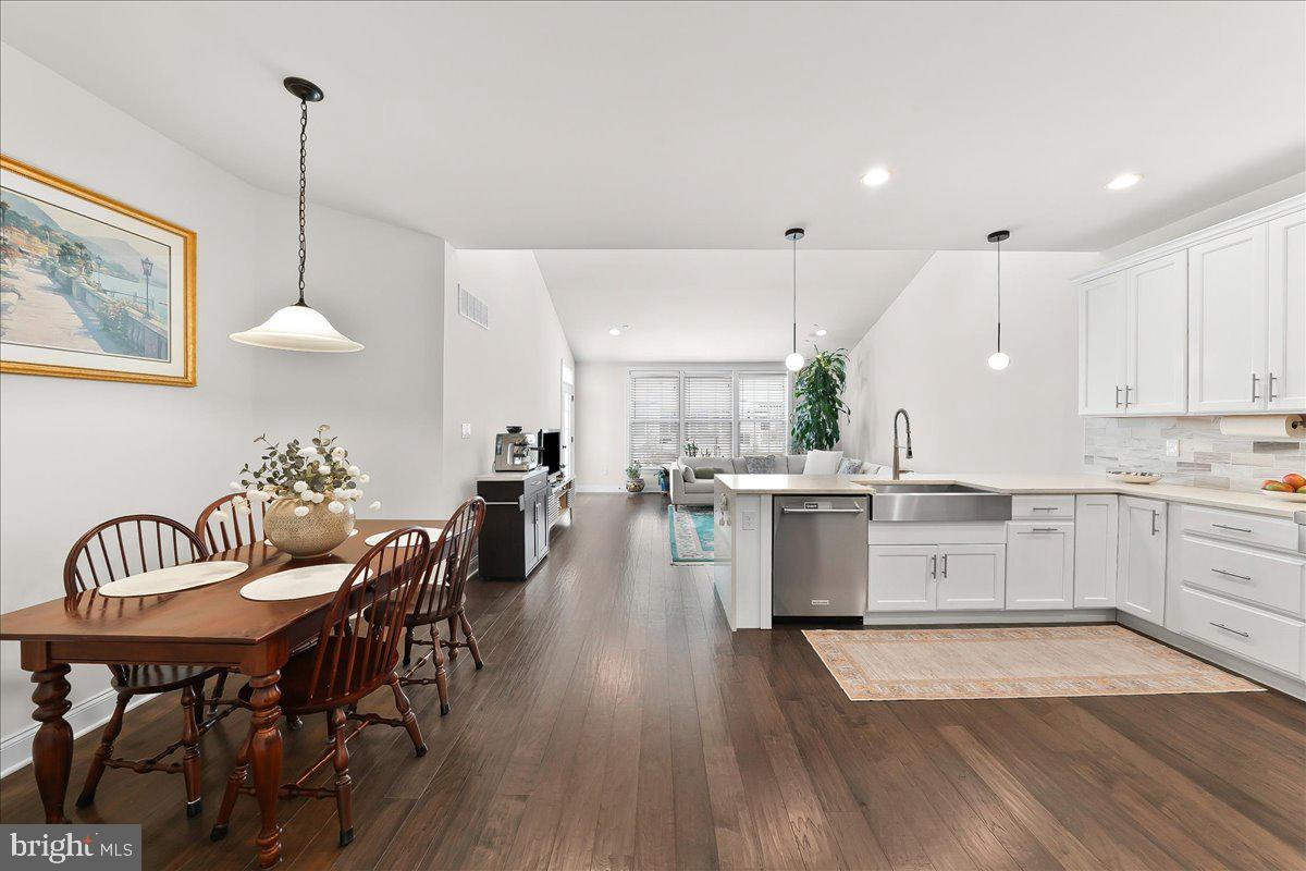 3718 Parris Boulevard Newtown Square, PA 19073 - Photo 11 of 52 a large kitchen with a table and chairs in it
