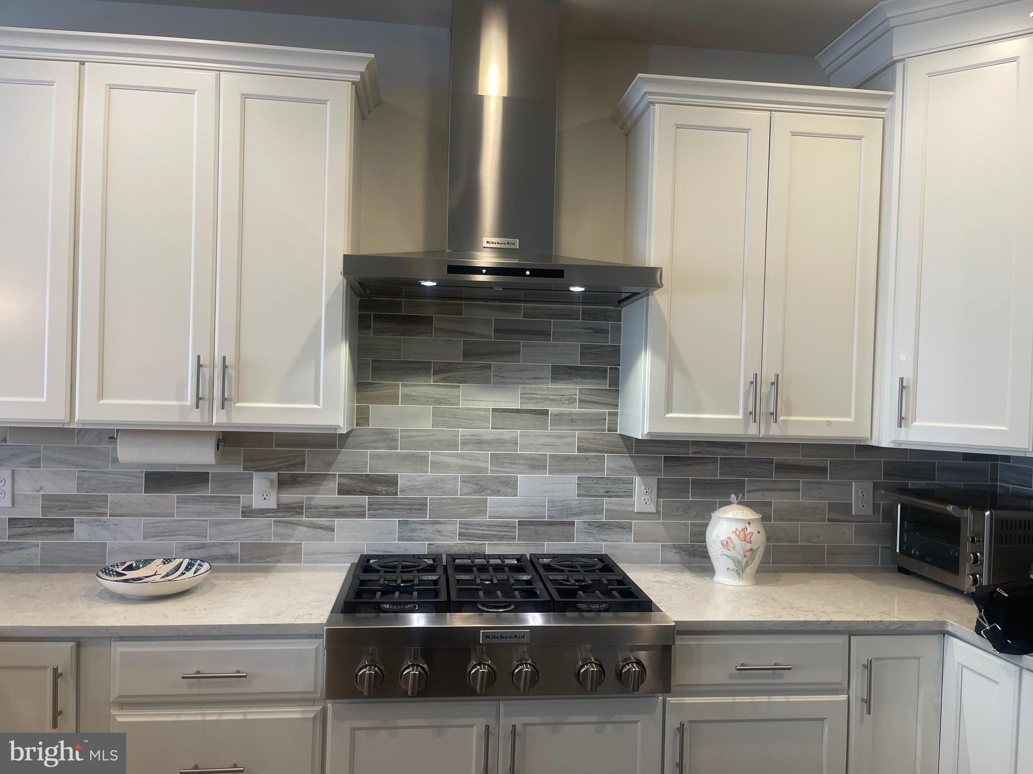 3718 Parris Boulevard Newtown Square, PA 19073 - Photo 13 of 52 a kitchen with granite countertop a stove sink and cabinets