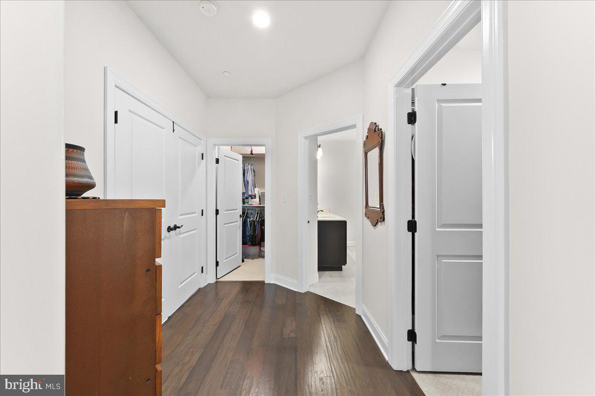 3718 Parris Boulevard Newtown Square, PA 19073 - Photo 21 of 52 a kitchen with stainless steel appliances a refrigerator and wooden floor