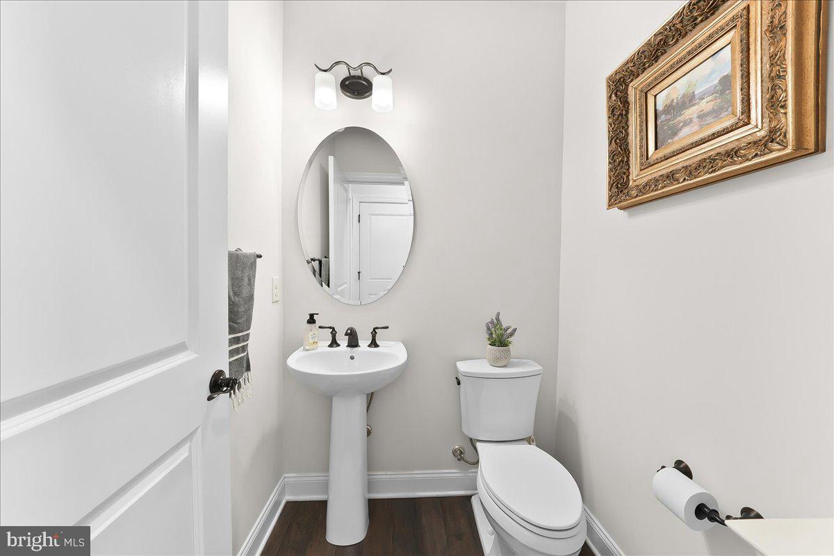 3718 Parris Boulevard Newtown Square, PA 19073 - Photo 28 of 52 a bathroom with a toilet sink and mirror