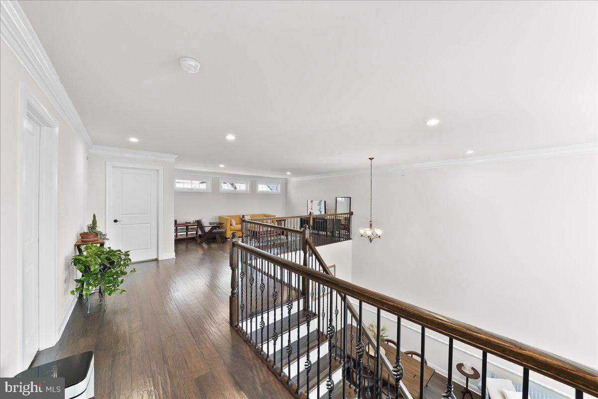 3718 Parris Boulevard Newtown Square, PA 19073 - Photo 31 of 52 a view of a hallway with wooden floor