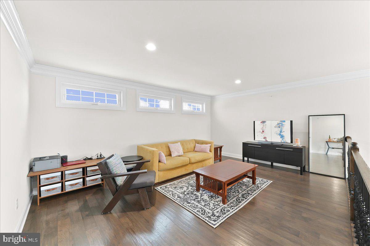 3718 Parris Boulevard Newtown Square, PA 19073 - Photo 32 of 52 a living room with furniture and a wooden floor