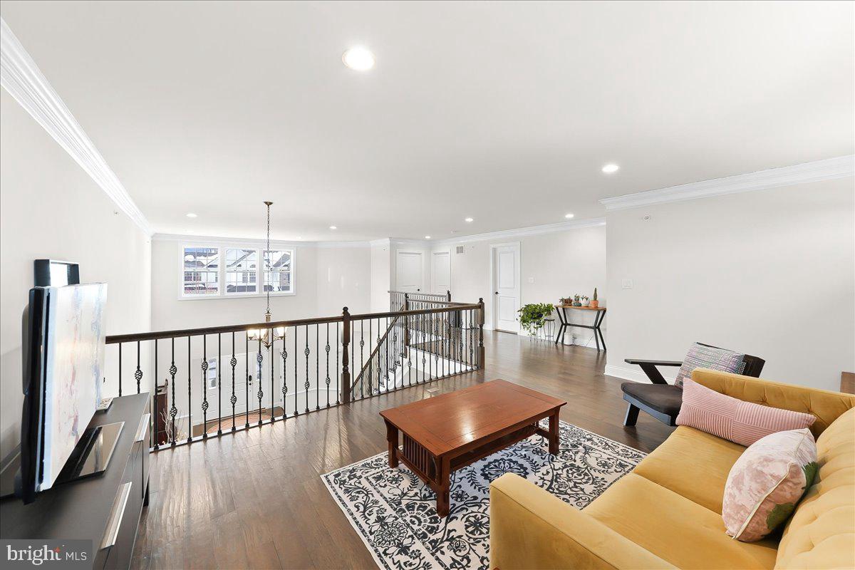 3718 Parris Boulevard Newtown Square, PA 19073 - Photo 33 of 52 a living room with furniture rug and wooden floor
