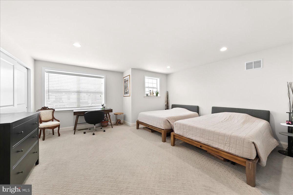 3718 Parris Boulevard Newtown Square, PA 19073 - Photo 35 of 52 a spacious bedroom with two beds and a couch