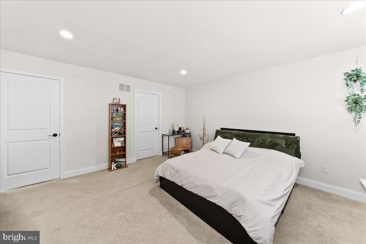3718 Parris Boulevard Newtown Square, PA 19073 - Photo 38 of 52 a bedroom with a bed and a walk in closet