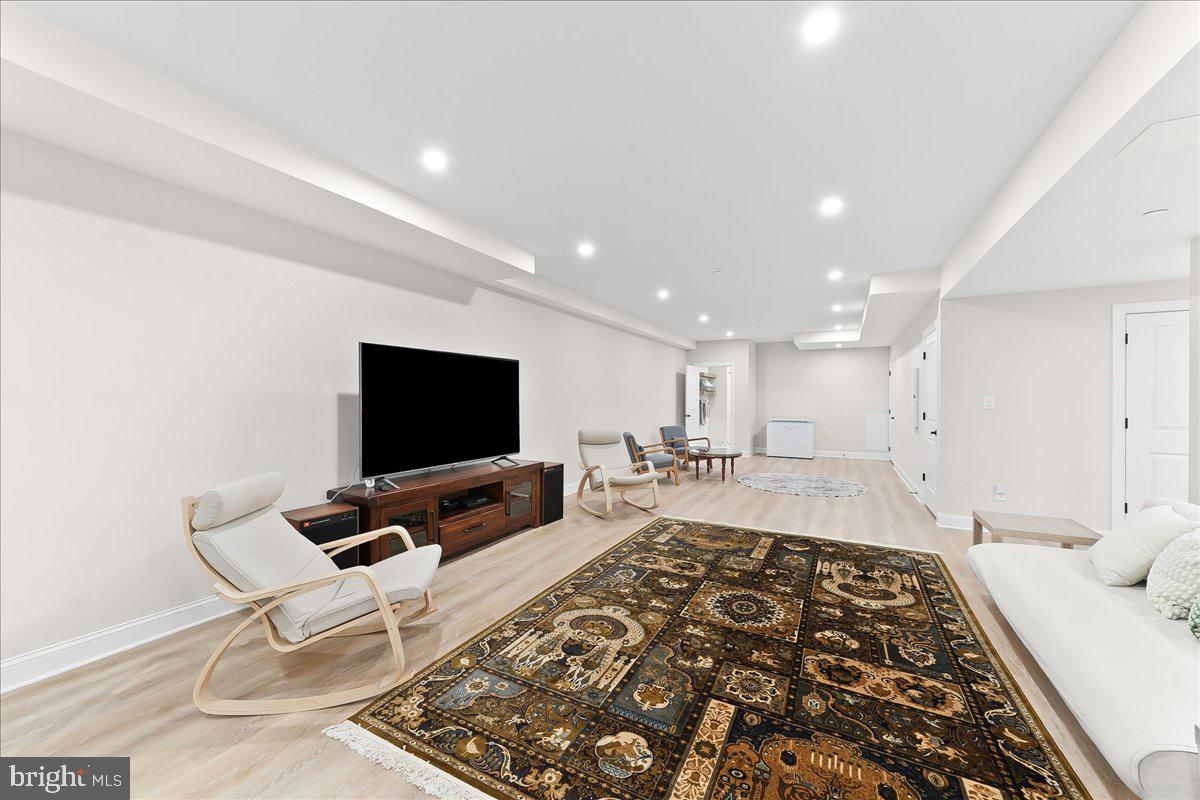 3718 Parris Boulevard Newtown Square, PA 19073 - Photo 44 of 52 a living room with a couch and a flat screen tv