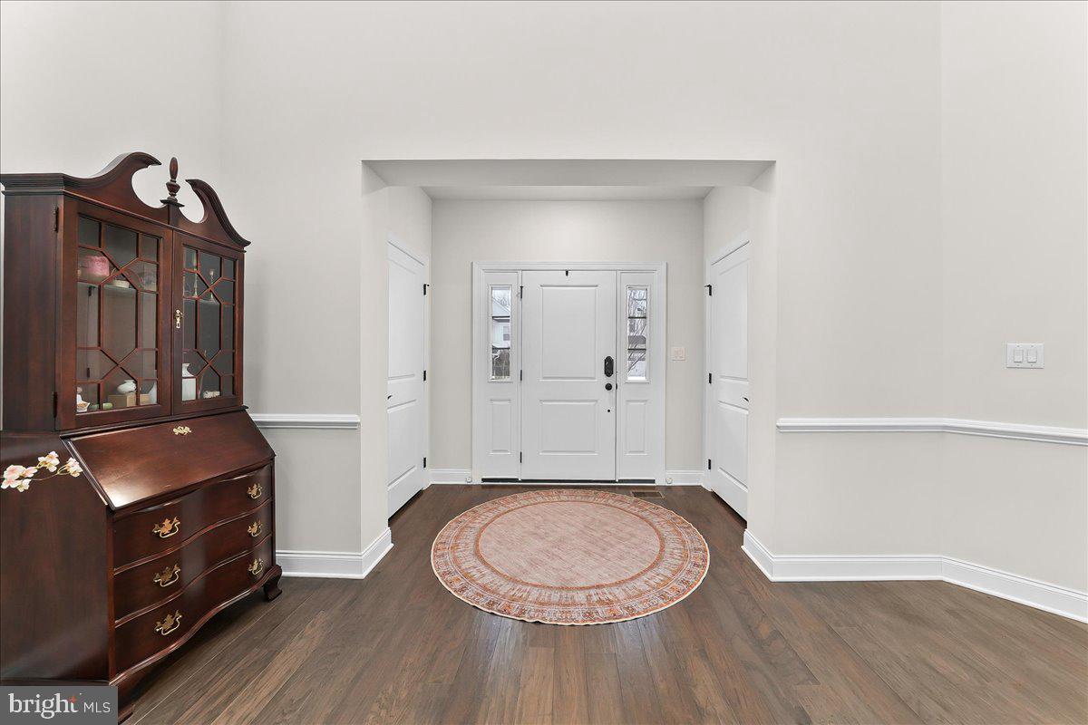 3718 Parris Boulevard Newtown Square, PA 19073 - Photo 6 of 52 a bathroom with a granite countertop toilet sink a mirror and vanity