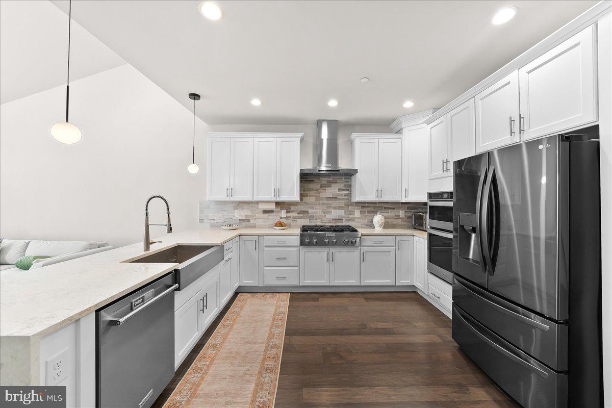 3718 Parris Boulevard Newtown Square, PA 19073 - Photo 9 of 52 a kitchen with a sink stainless steel appliances and cabinets