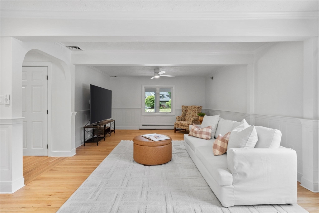 77 Bourque Road Lynnfield, MA 01940 - Photo 12 of 41 a living room with furniture a flat screen tv and a window