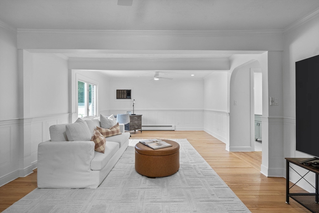 77 Bourque Road Lynnfield, MA 01940 - Photo 13 of 41 a living room with furniture and a flat screen tv