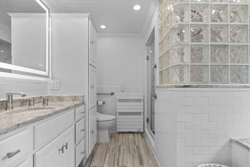77 Bourque Road Lynnfield, MA 01940 - Photo 23 of 41 a bathroom with a granite countertop sink toilet and shower