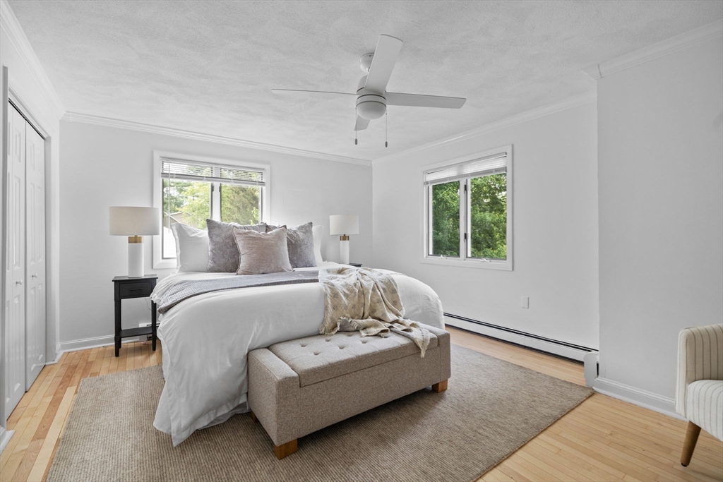 77 Bourque Road Lynnfield, MA 01940 - Photo 26 of 41 a bedroom with a bed lamp and a window