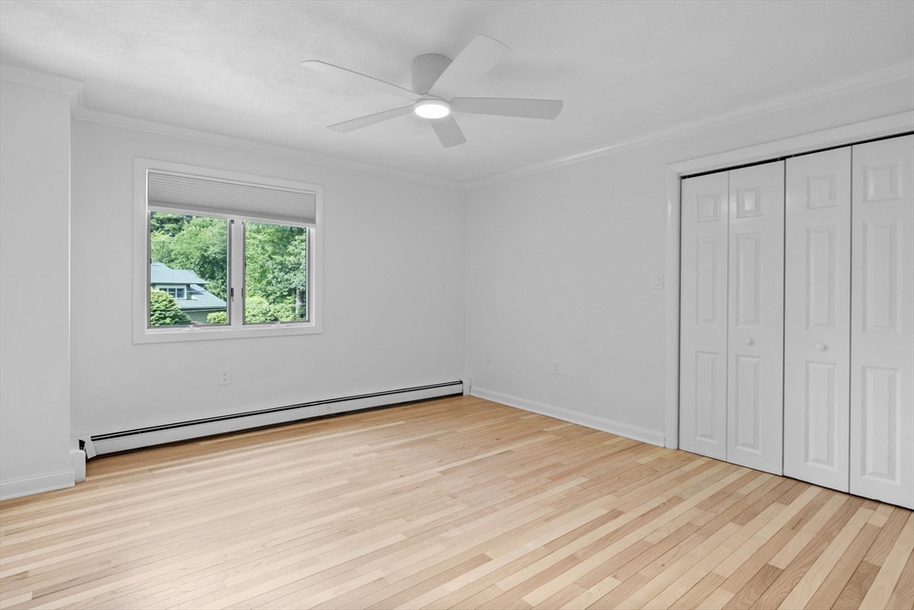 77 Bourque Road Lynnfield, MA 01940 - Photo 28 of 41 wooden floor in an empty room with a window