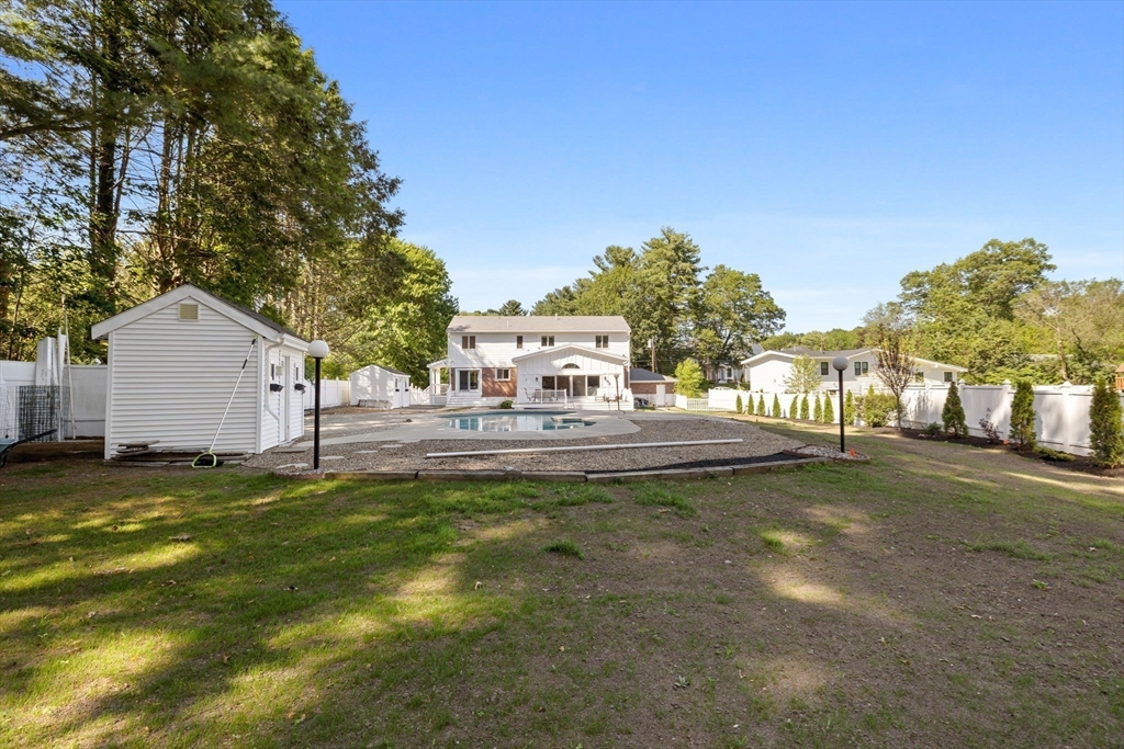 77 Bourque Road Lynnfield, MA 01940 - Photo 35 of 41 a view of a house with swimming pool and sitting area