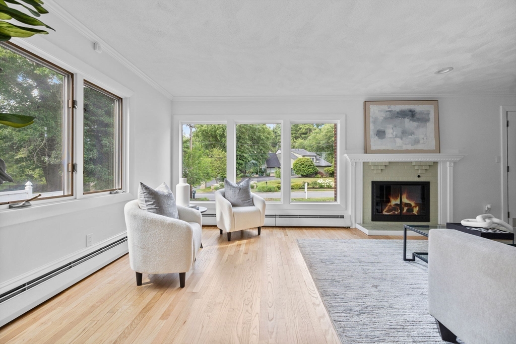 77 Bourque Road Lynnfield, MA 01940 - Photo 4 of 41 a living room with furniture and a fireplace