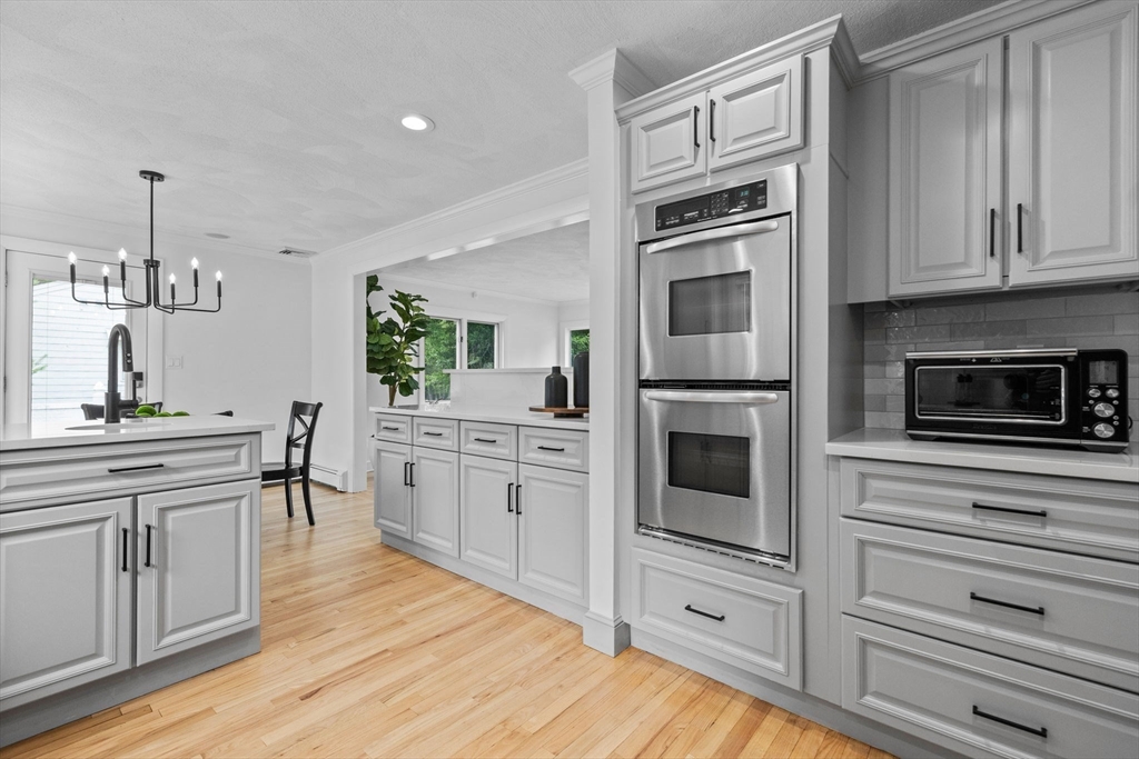 77 Bourque Road Lynnfield, MA 01940 - Photo 10 of 41 a kitchen with granite countertop stainless steel appliances and cabinets