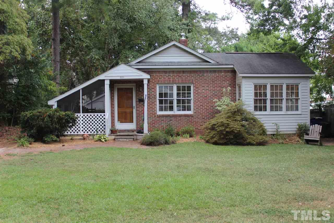 521 Mills Street Raleigh, NC 27608 - Photo 1 of 16 a front view of a house with a yard and garage