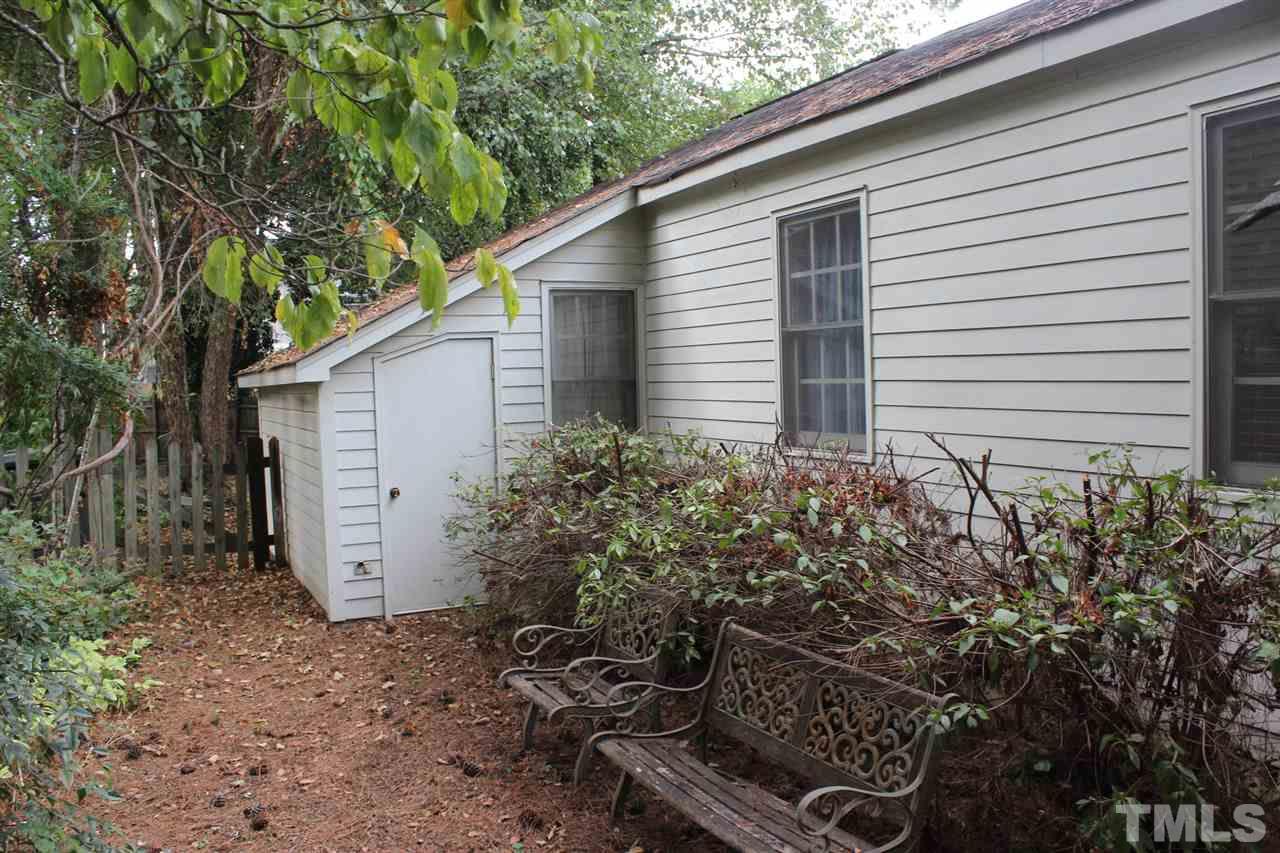 521 Mills Street Raleigh, NC 27608 - Photo 14 of 16 a view of a house with backyard and garden