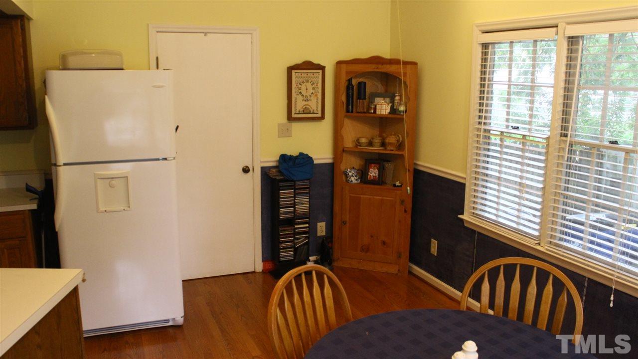 521 Mills Street Raleigh, NC 27608 - Photo 6 of 16 a white refrigerator freezer sitting inside of a kitchen