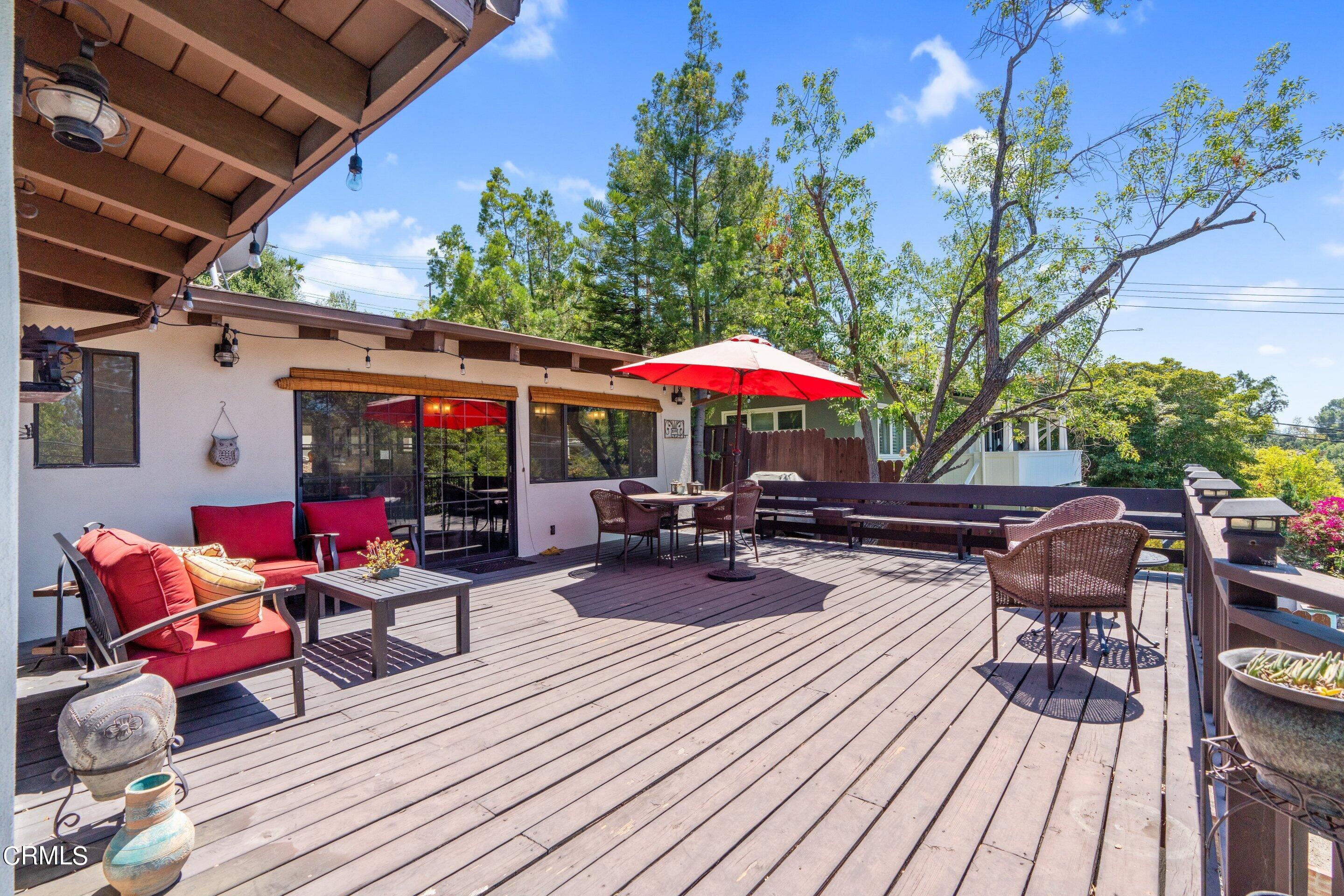 343 Cherry Drive Pasadena, CA 91105 - Photo 11 of 33 a view of deck with seating area and wooden floor