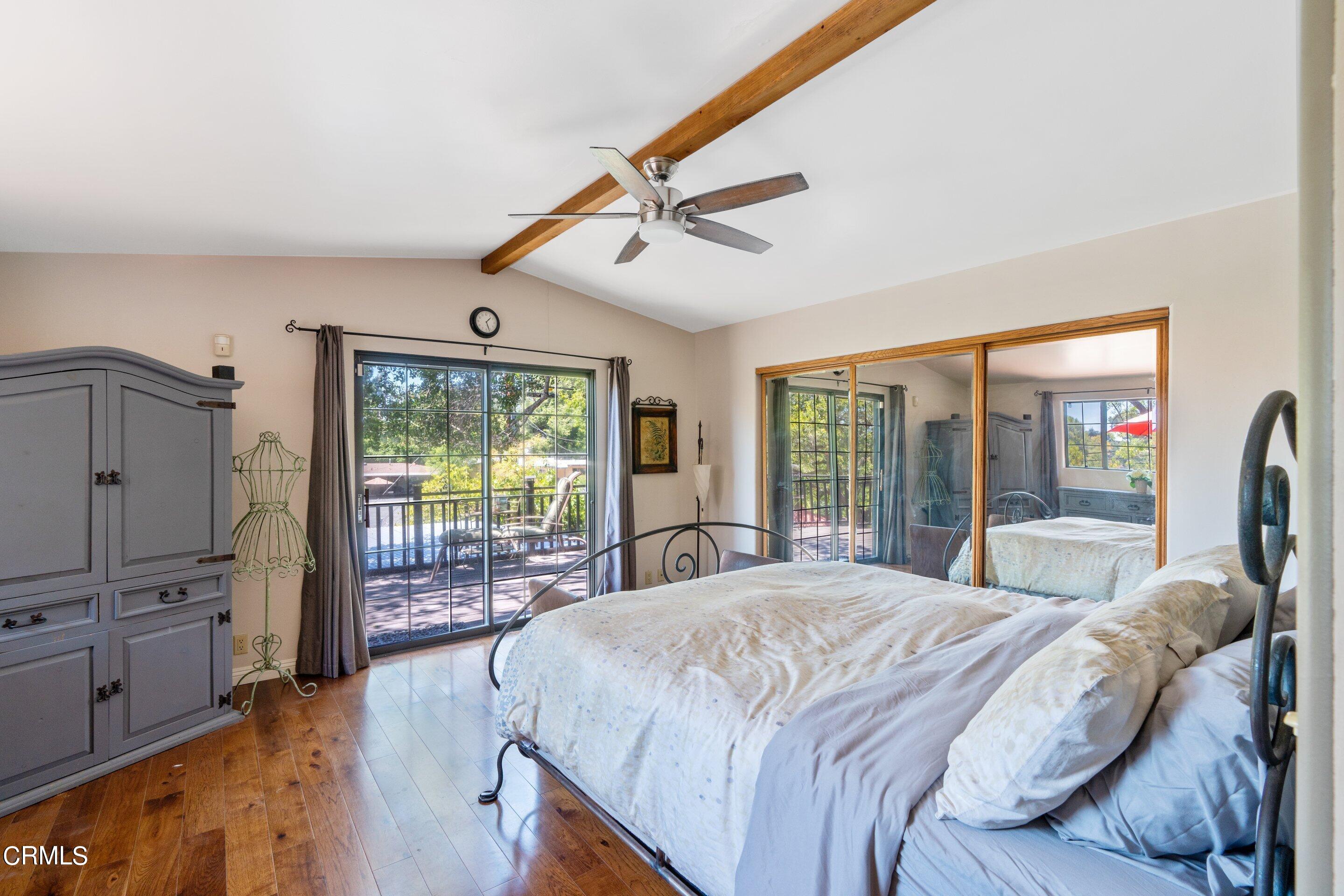 343 Cherry Drive Pasadena, CA 91105 - Photo 13 of 33 a bedroom with a bed and glass walk in closet