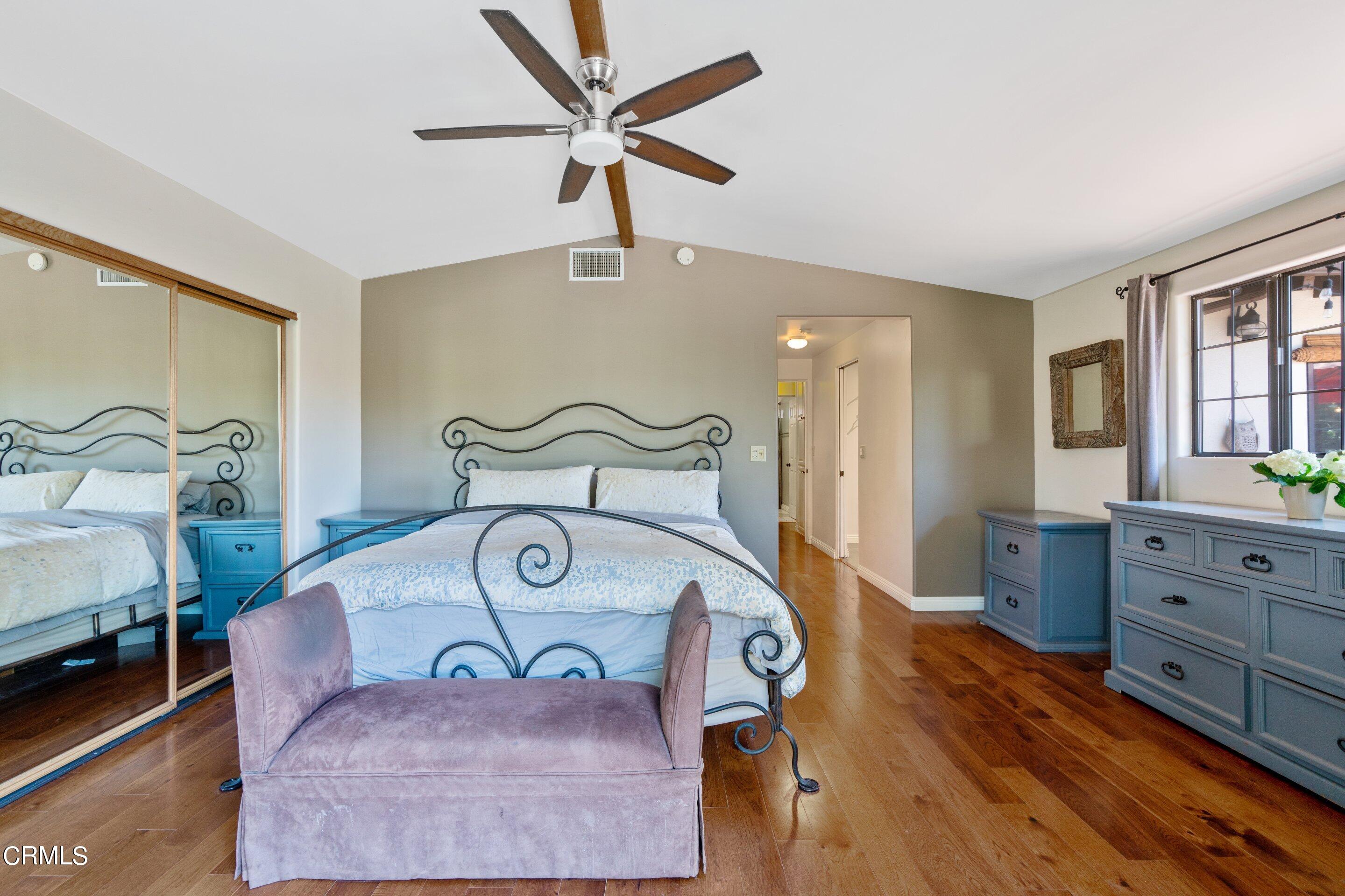 343 Cherry Drive Pasadena, CA 91105 - Photo 14 of 33 a bedroom with a bed and a chandelier